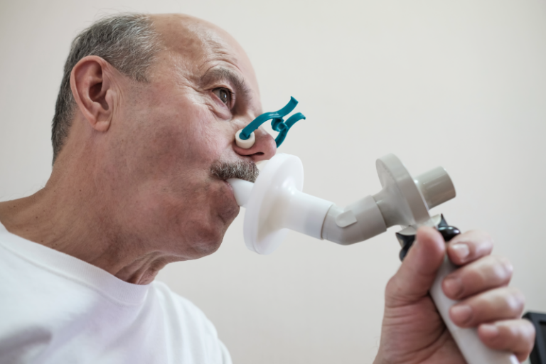 A patient using one of the respiratory testing machines provided by Aspire rural health system.