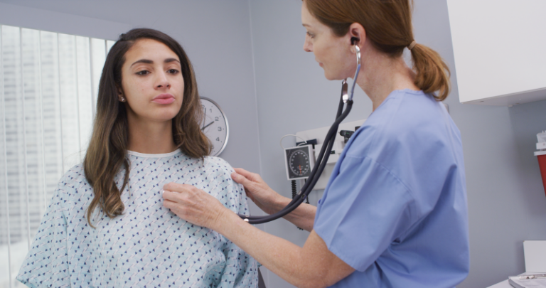 An Aspire health group professional providing one of their Respiratory Services to a patient.