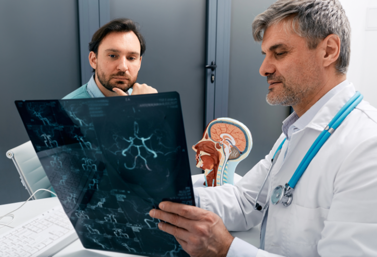 A neurology doctor going over results at Aspire Health Group.