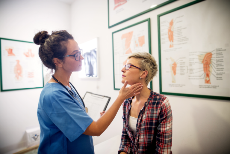 A nurse with a patient at a family health care center. Aspire offers internal medicine amongst other services.